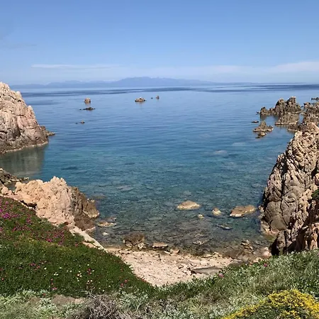 Designer Among Rocks, Art And Endless Blue Costa Paradiso